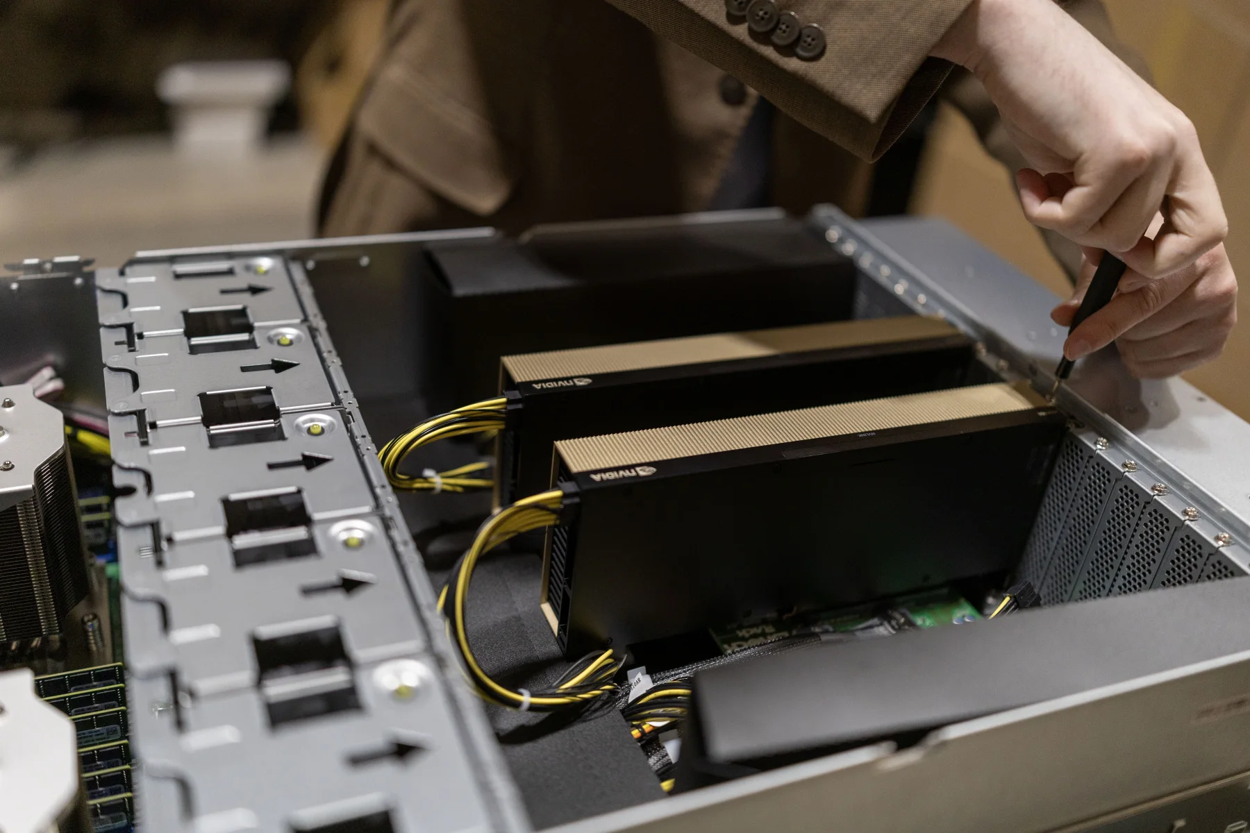 Andromeda technician installing two NVIDIA GPUs into a B3IQ server